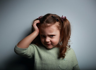 Wall Mural - Sad kid girl with headache looking unhappy