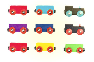 Wooden toy train setup - different colored cars