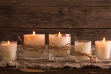 Scented Candles On Old Wooden Background