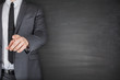 © Tuomas Kujansuu - Businessman front of Blackboard