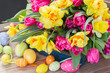 spring flowers bouquet with easter eggs