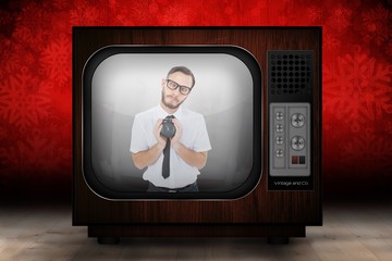 Poster - Composite image of geeky businessman holding alarm clock