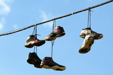 Sneakers Hanging On A Telephone Line