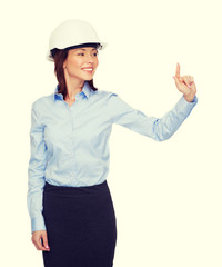 Canvas Print - young smiling businesswoman in white helmet