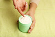 © Africa Studio - Female hands with jar of cream on fabric background