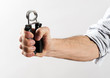Male Hand Exercising Strength Using Hand Gripper