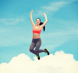 Wall Mural - sporty teenage girl jumping in sportswear