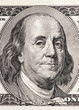 Close-up portrait of Benjamin Franklin in front of the one hundr