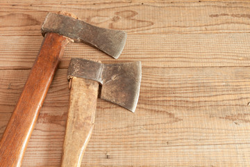 Two dated and used cleavers on wooden background