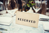Fototapeta  - Reserved sign on a table in restaurant