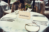 Fototapeta  - Reserved sign on a table in restaurant