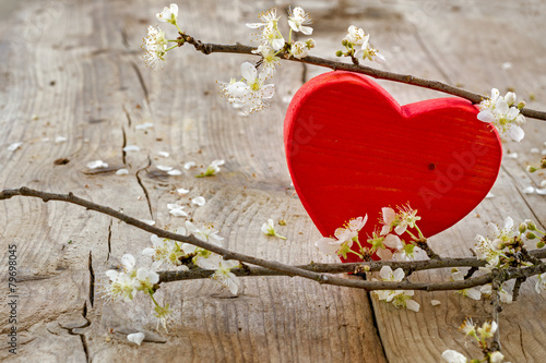Naklejka dekoracyjna red heart flower brancheson rustic wooden background, love symbo