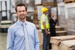 © WavebreakmediaMicro - Smiling male manager in warehouse