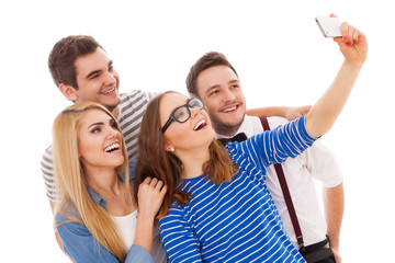 Four stylish young people on white background