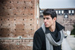 © theartofphoto - Young Man Outside the Building Looking Left