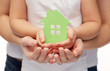 © Syda Productions - close up of woman and girl hands with paper house