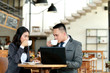 © Odua Images - businessman and businesswoman taking a coffee break