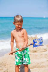 Poster - Boy playing on the beach