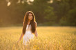 © kozirsky - beautiful woman posing in yellow wheat field