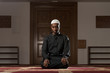 © Jale Ibrak - African Muslim Man Is Praying In The Mosque