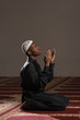 © Jale Ibrak - Young African Muslim Guy Praying