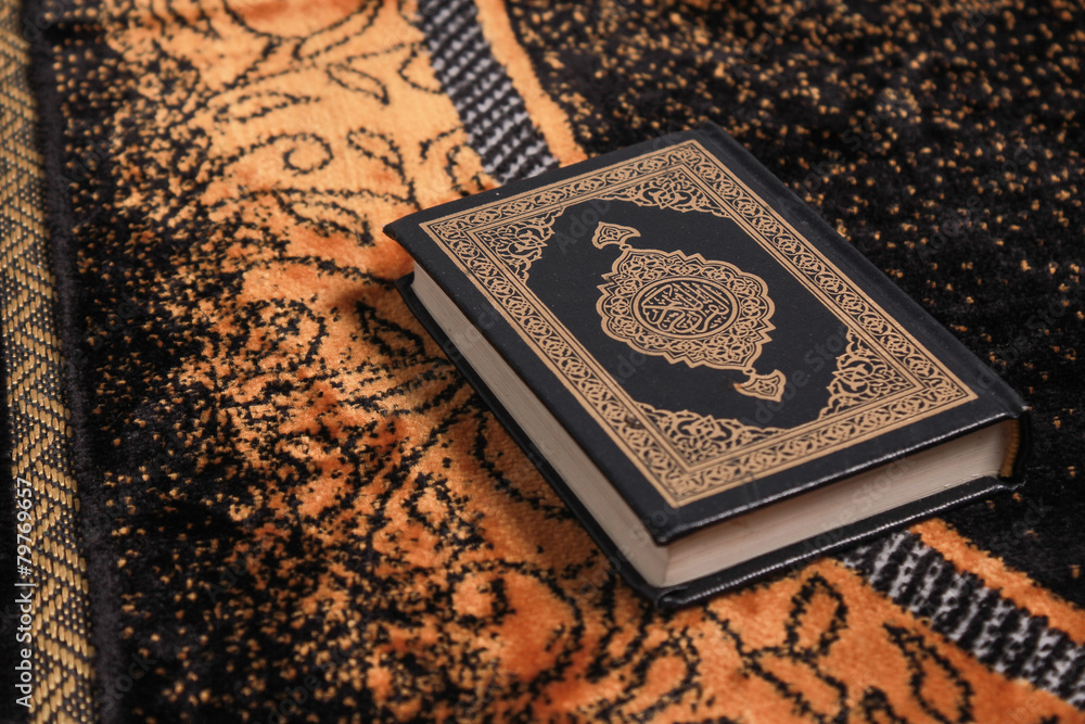 Quran Rug Quran on the prayer rug Stock Photo | Adobe Stock