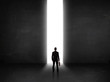 © ra2 studio - Business person looking at wall with light tunnel opening