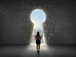 © ra2 studio - Business woman looking at keyhole with bright cityscape concept