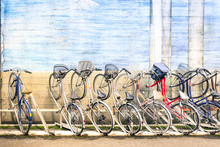 Multicolored Vintage Bicycles In Metal Rack In Tokyo City