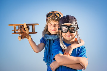 Sticker - Happy children playing with toy airplane