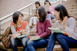 © Nonwarit - group of happy teen high school students outdoors