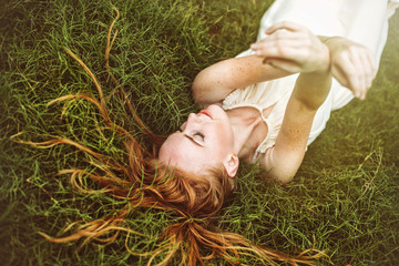 Beautiful sensual woman with long hair in nature