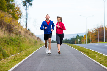 Wall Mural - Healthy lifestyle - woman and man running