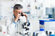 © lightpoet - senior male researcher carrying out scientific research in a lab