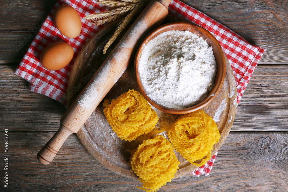 Still life of preparing pasta on rustic wooden background