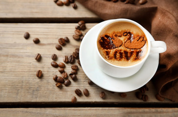 Cup of coffee on old wooden table