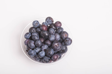 Wall Mural - Blueberries in Cup on White