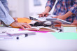 © lenetsnikolai - Young business people working at office on new project