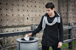 © theartofphoto - Young man outdoors throwing euro banknotes in a can