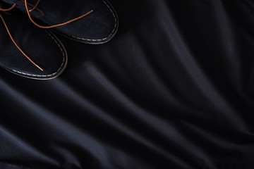 men's suede shoes on a black background
