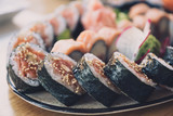 Fototapeta Tęcza - Close-up of sushi rolls