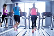 © .shock - Group of people running on treadmills