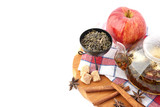 Fototapeta Mapy - Ripe apple, cinnamon and fruit drink in glass teapot on wooden