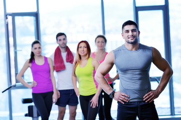 Wall Mural - Group of people exercising at the gym