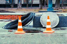 Open Manhole With Few Cables