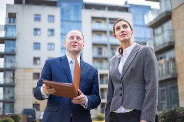 Man and woman looking up