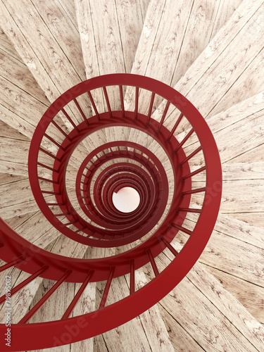 Fototapeta na wymiar Spiral stairs with red balustrade