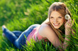 © nuzza11 - Beautiful woman are relaxing in a spring green field