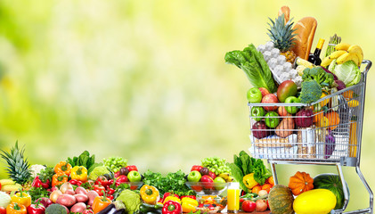 Wall Mural - Shopping cart with vegetables and fruits.