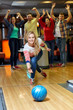 © Syda Productions - happy young woman throwing ball in bowling club